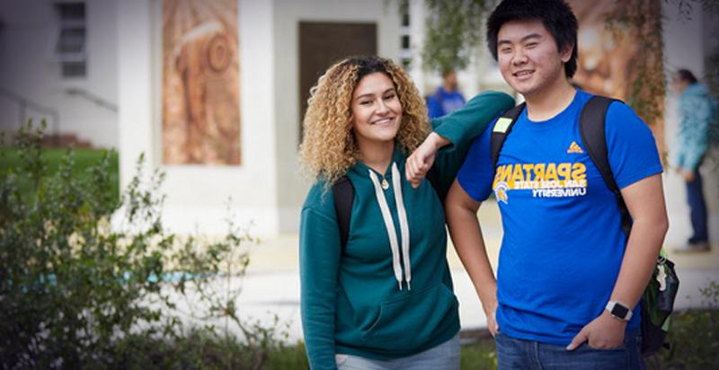 Two students casually standing